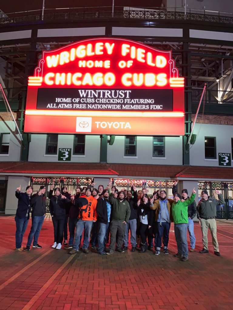 Team green in front of Wrigley field