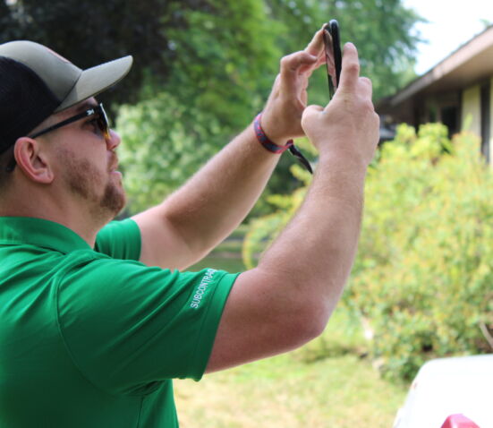 Seek Now team member taking photos