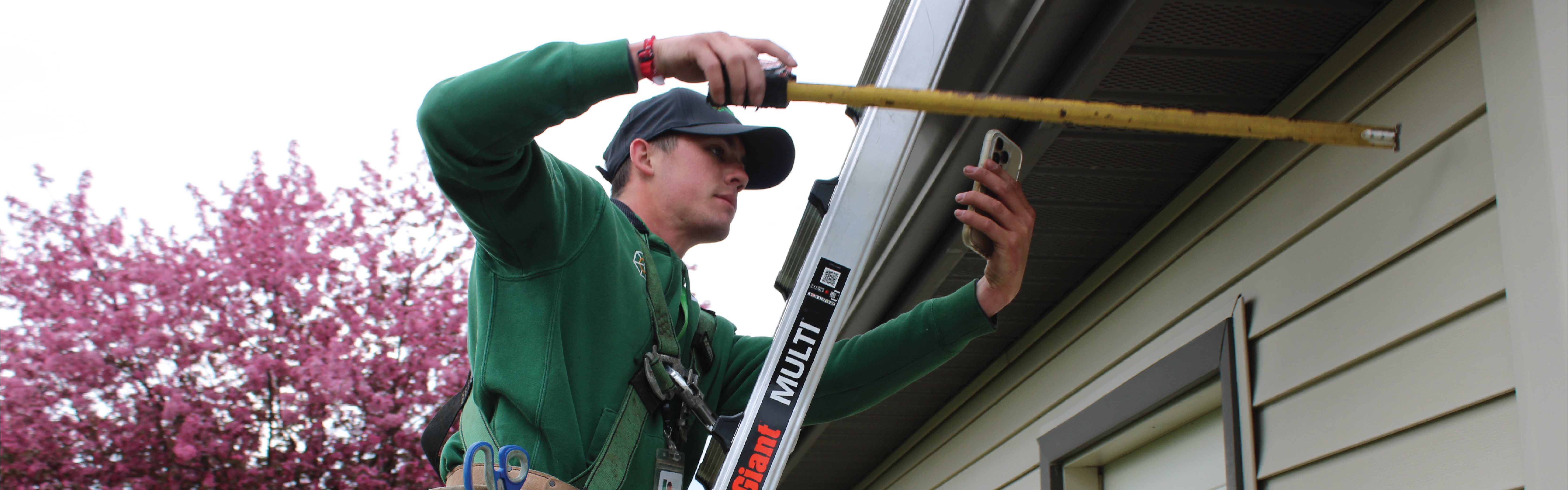 Inspector measuring wall