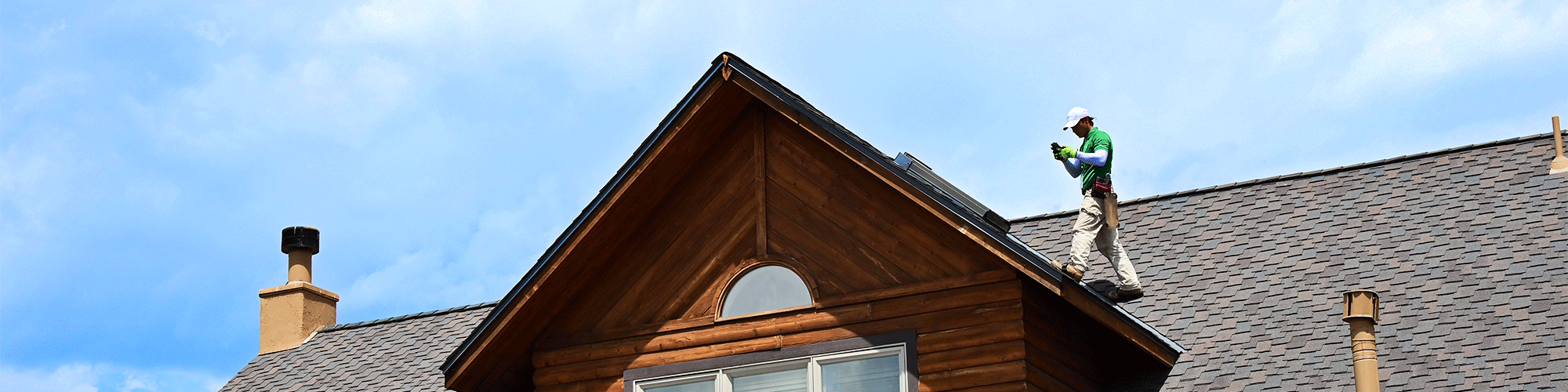 inspector taking photos on roof