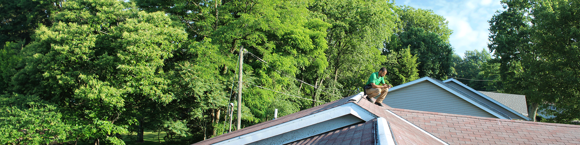 inspector taking a photo on the roof